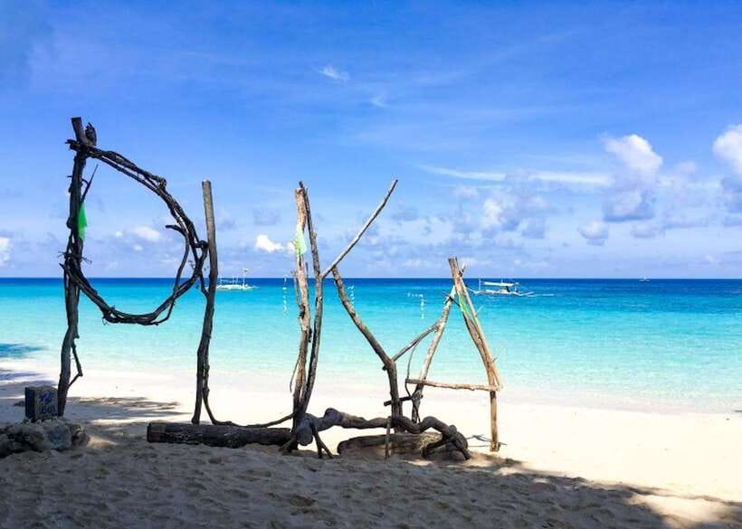 Boracay: Island and Beach-Hopping Boat Tour with Snorkeling - Puka Beach: the first proper swim