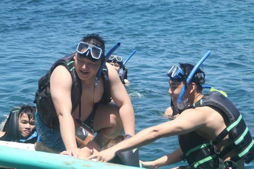 Boracay: Island and Beach-Hopping Boat Tour with Snorkeling - The riverside boat segment and Filipino buffet