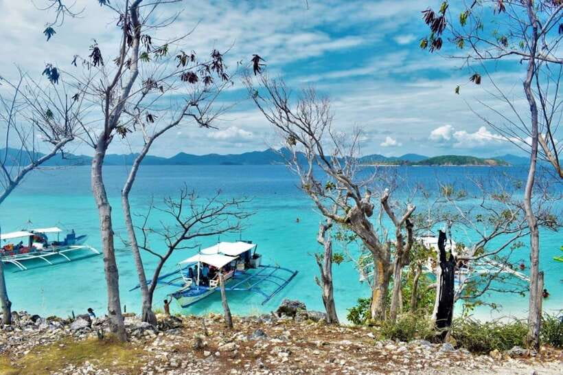 Coron: Coastal Cliffs, Beach & Malcapuya Island Hopping Tour - Snorkeling in clear water, with one important check