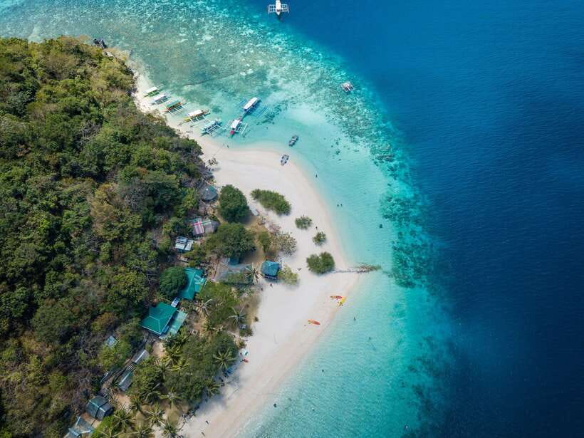 Coron: Coastal Cliffs, Beach & Malcapuya Island Hopping Tour - Setting out by Philippine banca