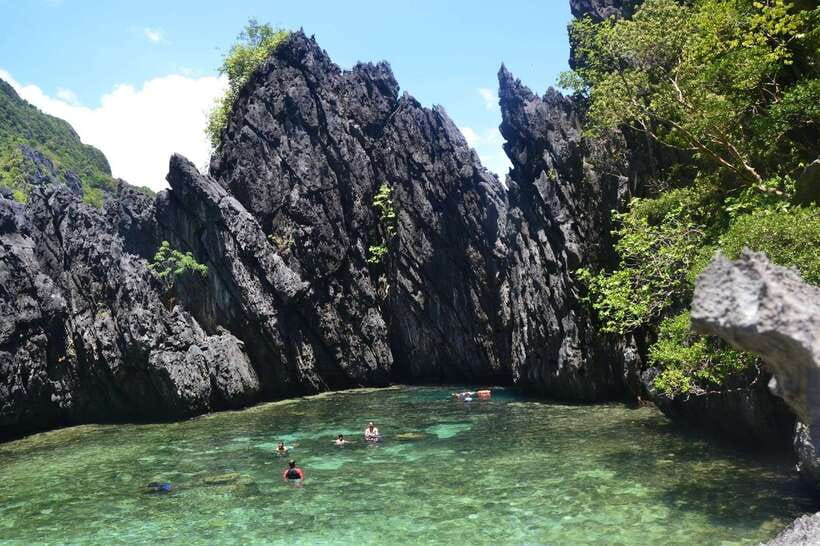 El Nido Island Hopping Tour C: Hidden Beaches & Shrine - Matinloc Shrine and the view above the water