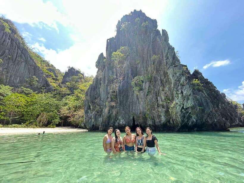 El Nido: Shared Island Hopping Tour C with Buffet Lunch - Hidden Beach requires a short swim into the cliffs