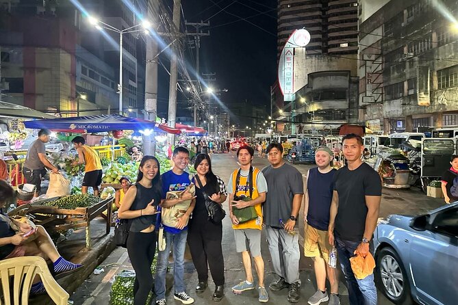Manila Night Market Experience with Local Guide - Street food with help at the stall