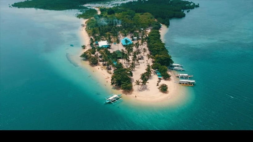 Puerto Princesa: Cowrie Island Guided Day Tour with Meal - From your hotel to the Honda Bay wharf